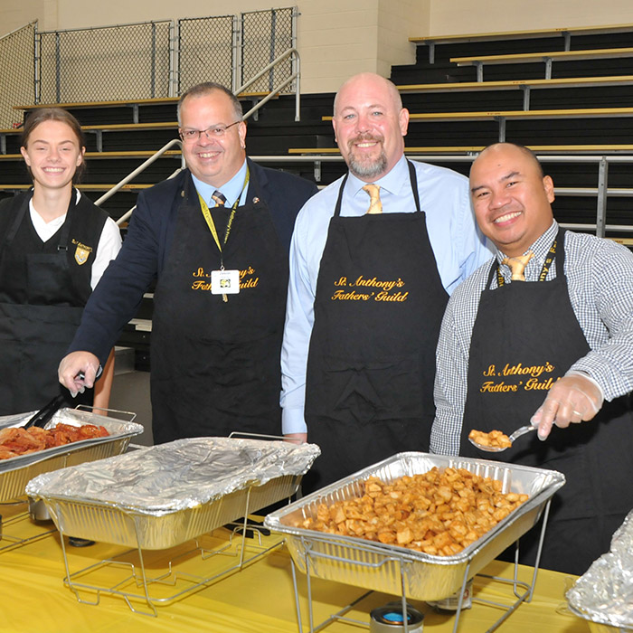 Fathers Guild serving breakfast after mass