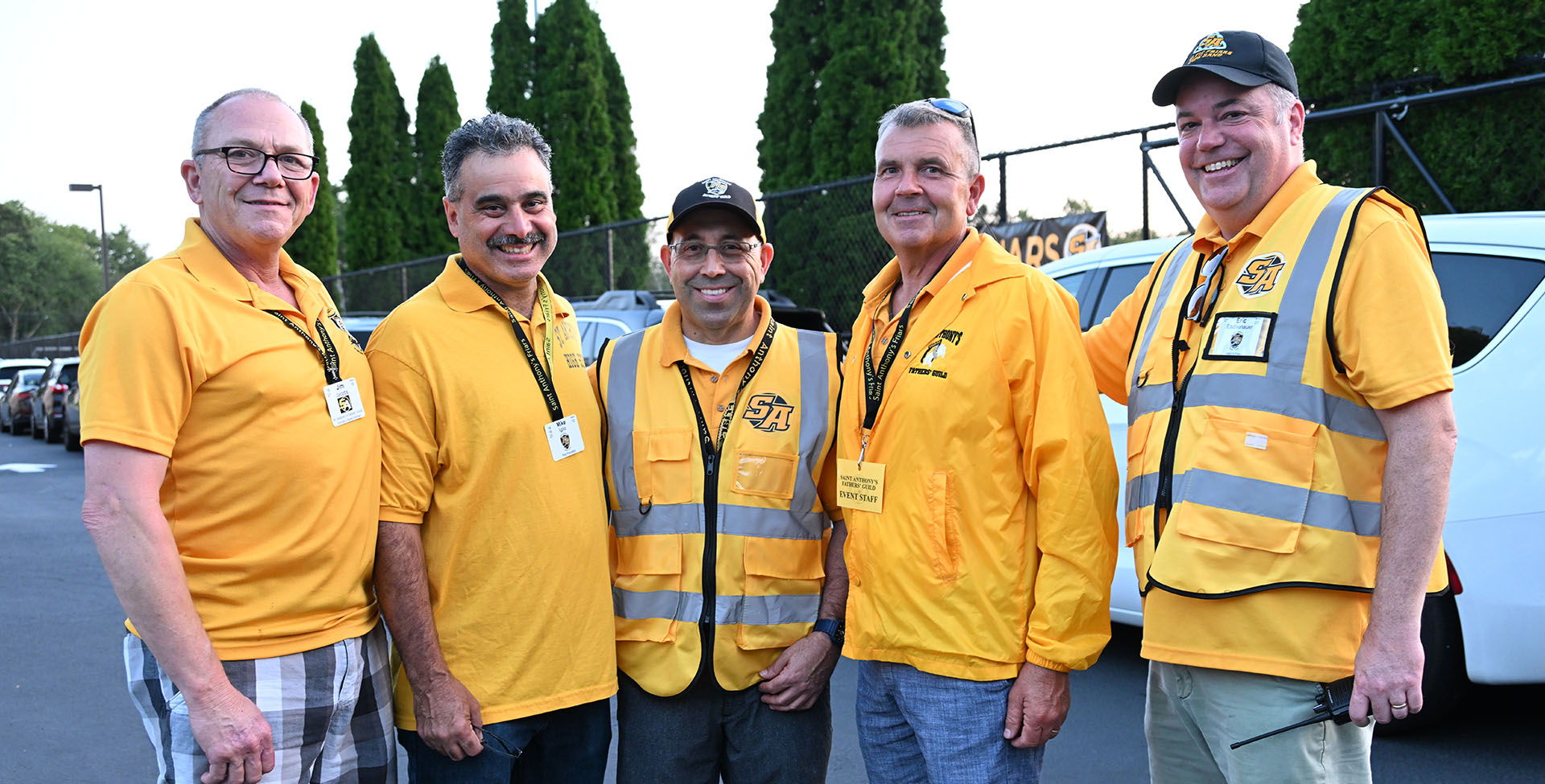 Fathers' Guild running the parking lot at Meet the Teacher Night